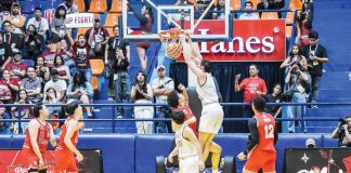 University of the Philippines Fighting Maroons’ Quentin Millora-Brown scores on a two-handed dunk. UAAP PHOTO