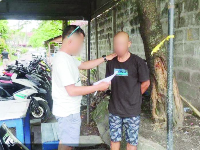 47_fugitives_1_resized Alias “Ethan” (right) who faces statutory rape charges was arrested by officers of the Bacolod City Police Office. BACOLOD CITY POLICE OFFICE PHOTO