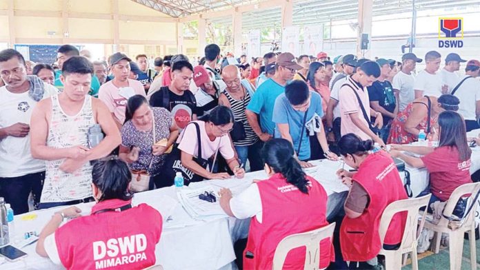 The Ayuda para sa Kapos ang Kita Program (AKAP) was launched nationwide by the Department of Social Welfare and Development (DSWD) on May 18, 2024 with an initial funding of P3 billion. Photo taken that day and released by the DSWD’s Mimaropa field office shows the first wave of applicants who came for the cash assistance ranging from P3,000 to P5,000 per beneficiary. INQUIRER.NET PHOTO