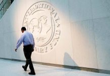 IMF urges restoration of LandBank, DBP capital after Maharlika Fund infusions A man walks past the International Monetary Fund logo at its headquarters in Washington, U.S. REUTERS/YURI GRIPAS/FILE PHOTO