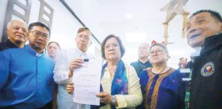Former senator and Justice secretary Leila de Lima (holding paper) leads the filing of the first impeachment complaint against Vice President Sara Z. Duterte at the House of Representatives in Quezon City on Monday (Dec. 2, 2024). The group cited culpable violation of the constitution, graft and corruption, bribery, and betrayal of public trust, among others. PNA photo by Joan Bondoc