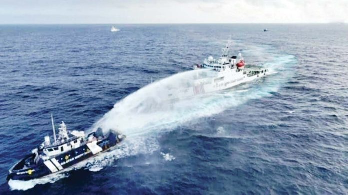 PCG-1 Using water cannon, a Chinese ship harasses a Philippine vessel conducting a routine maritime patrol within Bajo de Masinloc in the West Philippine Sea on Wednesday morning. PHOTO COURTESY OF PCG, NTF-WPS