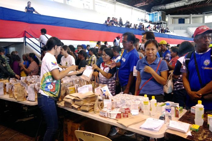 PHOTO 1 Residents of Ilocos Norte receive basic health services during the Bawat Buhay Mahalaga Serbisyo Caravan held at the Centennial Arena in Laoag City on November 29-30.