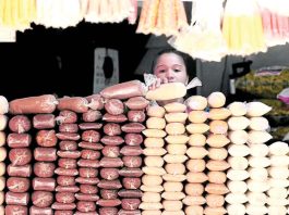 Sugar industry backs all domestic classification amid production slump A woman stacks sugar at a store in Manila. INQUIRER/ MARIANNE BERMUDEZ