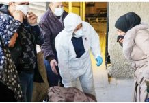 Syrian rebels to name Assad officials wanted for torture Relatives retrieved some of the bodies found at Harasta hospital in Syria after they were identified. AFP