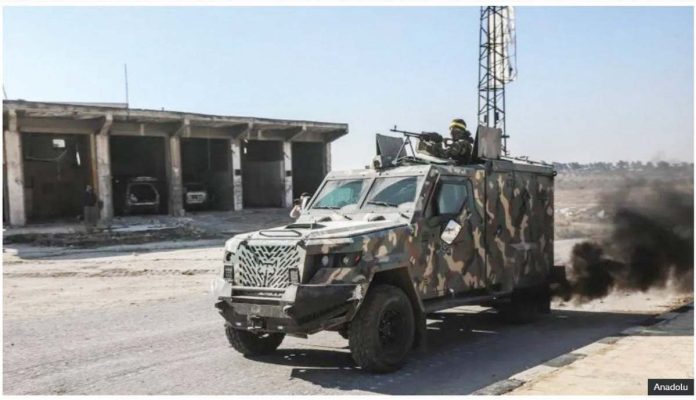 Syria_1_resized Rebel fighters led by Hayat Tahrir al-Sham (HTS) drive an armored vehicle during an offensive against government forces in north-western Syria. ANADOLU