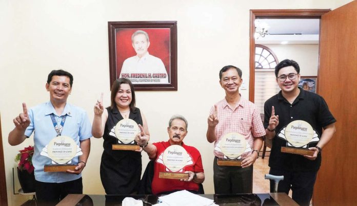 capiz_pagdayaw_resized Alphonsus D. Tesoro (second from right), Provincial Tourism and Cultural Affairs Officer of Capiz, presents to Gov. Fredenil Castro (center) and Atty. Luvim D. Amores (second from left), PIO/concurrent head of HRMO, the awards received by the province during the Pagdayaw 2024: Western Visayas Tourism Awards of the Department of Tourism Region 6. CAPIZ PROV’L GOV’T COMMUNICATIONS GROUP PHOTO