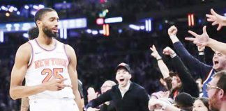 New York Knicks’ Mikal Bridges gestures after making a three-pointer.