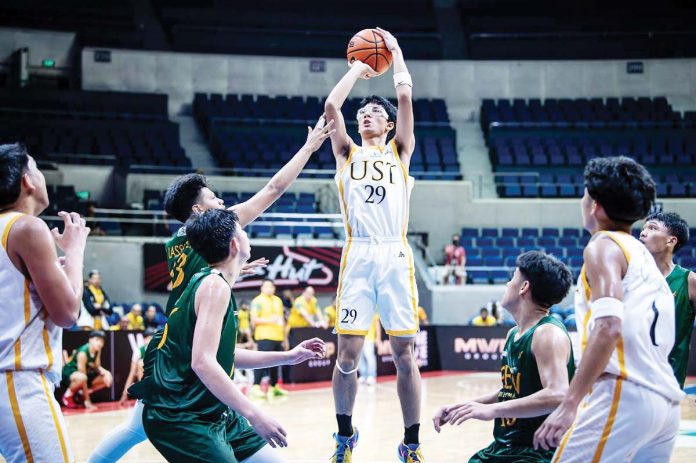 sports-Castro University of Santo Tomas Tiger Cubs’ Gab Castro attempts from inside. UAAP PHOTO