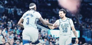 Orlando Magic’s Cole Anthony gets a high-five from teammate Kentavious Caldwell-Pope after his game-winning layup. PHOTO COURTESY OF ORLANDO MAGIC