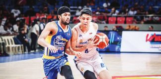 TNT Tropang Giga’s Calvin Oftana protects the ball from the defense of Magnolia Chicken Timplados Hotshots’ Jerrick Ahanmisi. PBA PHOTO