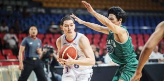 NLEX Road Warriors’ Robert Bolick Jr. protects the ball from the defense of Negrense guard Mark Nonoy of Terrafirma Dyip. PBA PHOTO