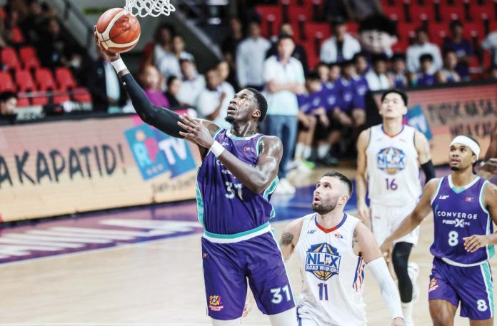sports_PBA_resized Converge FiberXers’ Cheick Diallo attempts a reverse layup. PBA PHOTO