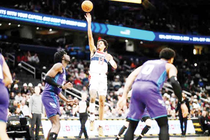 Washington Wizards’ Jordan Poole attempts a one-handed shot. AP