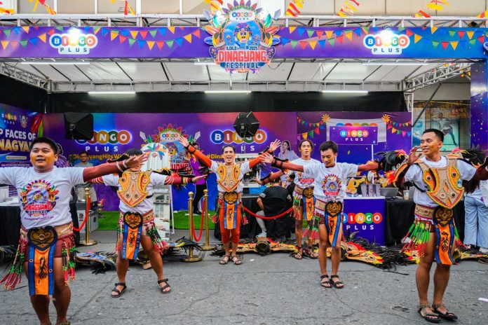 A dance group performing at the BingoPlus booth during the Dinagyang Festival.
