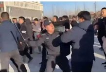 Violent protests in China after student falls to his death A policeman beats a protester with a baton in Pucheng, Shaanxi province in China during large-scale demonstrations. BBC