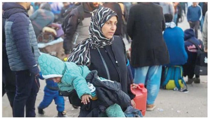 Gaza_1_resized Palestinians wait to be allowed to go to their homes in the Gaza Strip. GETTY IMAGES