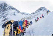 Nepal hits Everest climbers with higher permit fees A line of mountain climbers hike across a snow-covered slope with mountain peaks in the background. Nepal is often criticized for allowing too many climbers on Everest. GETTY IMAGES