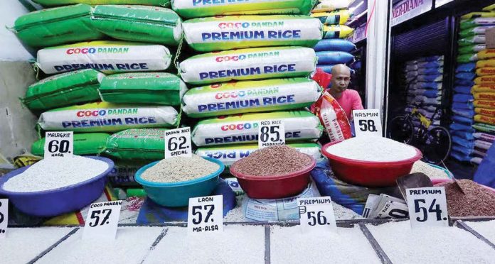 SRP_importRice vendor Eddie Pascual waits for customers at Marikina Public Market on Monday, Jan. 6, 2025. The Department of Agriculture says it will announce “very soon” the maximum suggested retail price for imported rice to help lower prices. INQUIRER.NET/GRIG C. MONTEGRANDE PHOTOed_rice_resized Rice vendor Eddie Pascual waits for customers at Marikina Public Market on Monday, Jan. 6, 2025. The Department of Agriculture says it will announce “very soon” the maximum suggested retail price for imported rice to help lower prices. INQUIRER.NET/GRIG C. MONTEGRANDE PHOTO