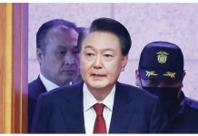 Impeached S. Korea president charged with insurrection South Korea’s impeached President Yoon Suk Yeol arrives for his impeachment trial dressed in a dark blazer, red tie and white shirt. REUTERS
