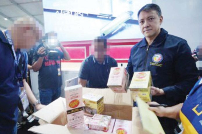 Tobacco_revenues_resized Bureau of Internal Revenue (BIR) Commissioner Romeo Lumagui Jr. shows some of the confiscated illicit vape products during a raid at the Philippine Vape Festival 2024 on Aug. 18, 2024 in Las Piñas City. BIR PHOTO
