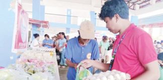 Beneficiaries of Walang Gutom Program from Sebaste, Antique claim their food commodities. DSWD WESTERN VISAYAS/FB PHOTO