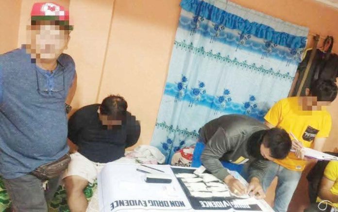 A high-value drug suspect (second from left) was apprehended in an anti-illegal drug operation in Zone 2, Barangay Bakhaw, Mandurriao, Iloilo City on Jan. 13, 2025. Police seized around 50 grams of suspected shabu with an estimated value of P340,000.