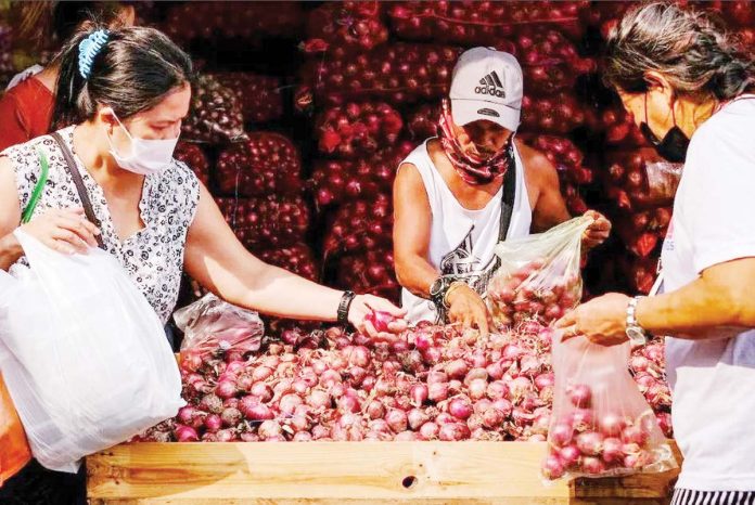 cold-storage-1 The Department of Agriculture says that improving the cold chain infrastructure will strengthen the agricultural sector, reduce farm losses, extend the shelf life of agricultural products, stabilize supply and prices, and ensure food security. Photo shows customers sifting through red onions at a stall in Divisoria market in Manila. GEORGE CALVELO, ABS-CBN NEWS/FILE