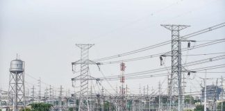 High voltage towers that support transmission lines for electrical power distribution in the Luzon grid is seen from a residential area in Baesa, Quezon City. MARIA TAN, ABS-CBN NEWS PHOTO