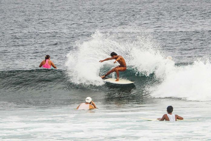 employment_resized A tourist surfs the waves in General Luna town in Siargao, the surfing capital of the Philippines and home to some of the best beaches in Asia. FERDINANDH CABRERA/AFP PHOTO