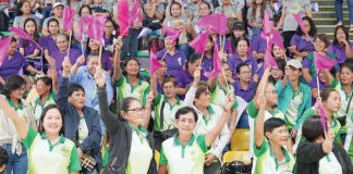 Barangay Nutrition Scholars enthusiastically wave flags during the BNS Big Day in Passi City Arena, showing their eagerness to championing food security and nutrition initiatives in Iloilo Province. Photo from Balita Halin sa Kapitolyo