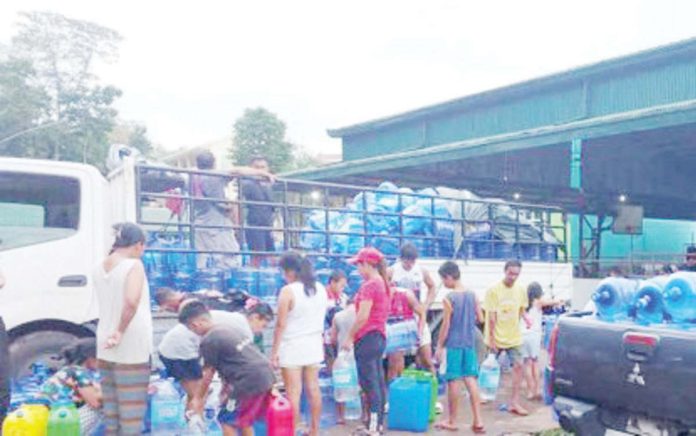 negocc_solutions_1_resized Residents of La Castellana, Negros Occidental displaced by the eruption of Mt. Kanlaon line up for drinking water in one of the evacuation centers on Dec. 28, 2024. PIO NEGROS OCCIDENTAL PHOTO