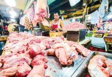 Lower pork prices seen within March A vendor has an abundant supply of different pork meat and other by-products at a market in Quezon City on Jan. 14, 2025. PNA PHOTO BY JOAN BONDOC