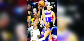 Cleveland Cavaliers center Tristan Thompson (13) blocks a shot by Phoenix Suns forward Ryan Dunn (0). Photo courtesy of David Richard/Imagn Images