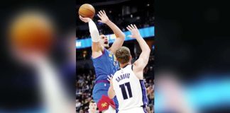 Denver Nuggets’ Nikola Jokic scores over the defense of Sacramento Kings' Domantas Sabonis. AP PHOTO