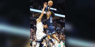 Memphis Grizzlies' Ja Morant attacks the defense of Minnesota Timberwolves' Rudy Gobert for an inside hit. AP PHOTO