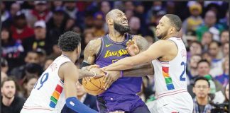 PHILADELPHIA 76ers’ Justin Edwards and Eric Gordon converge upon LeBron James of Los Angeles Lakers during the first half of their game. Photo courtesy of Charles Fox/The Inquirer