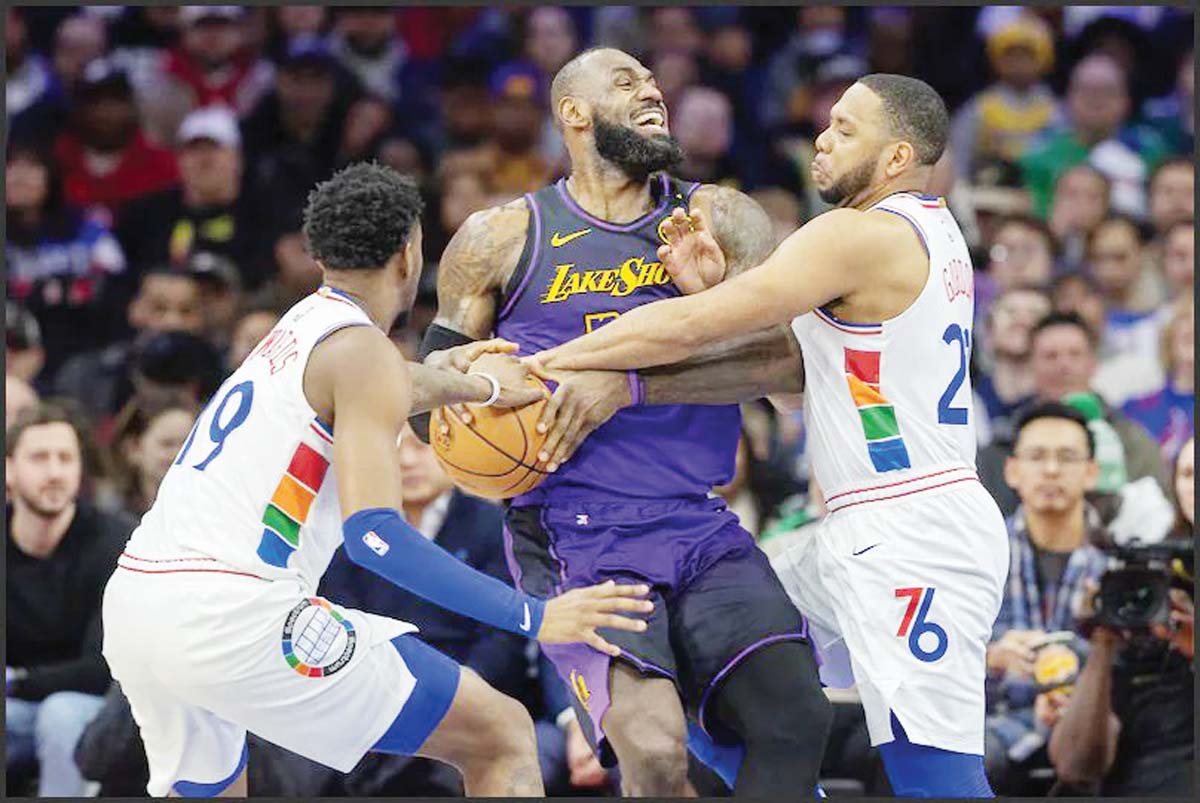 Shorthanded 76ers upset Lakers