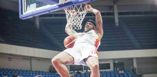 Phoenix Fuel Masters’ Donovan Smith hangs in the ring after a two-handed dunk. PBA PHOTO