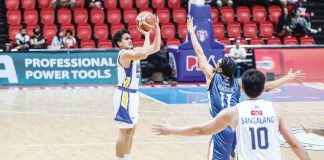 Magnolia Chicken Timplados Hotshots’ Peter Alfaro pulls up for a three-pointer against the defense of Meralco Bolts' Chris Newsome. PBA PHOTO