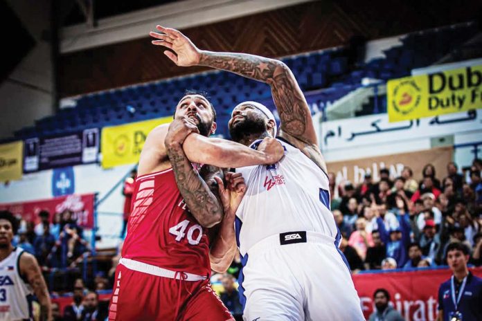 sports-SGA-1 Strong Group Athletics-Pilipinas’ DeMarcus Cousins battles Beirut First’s Mohamad Ali Haidar for the rebound. PHOTO COURTESY OF DUBAI BASKETBALL CHAMPIONSHIP