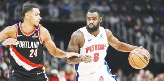 Detroit Pistons’ Tim Hardaway Jr. (8) drives past the defense of Portland Trail Blazers' Kris Murray (24). LON HORWEDEL/IMAGN IMAGES