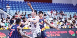 NLEX Road Warriors’ Robert Bolick Jr. eludes the defense of Rain or Shine Elasto Painters’ Jhonard Clarito for a layup. PBA PHOTO