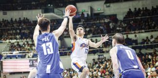 Ilonggo Anjo Caram of Meralco Bolts tries to score against the defense of Hong Kong Eastern’s Yuet Yeung Pok. PBA PHOTO