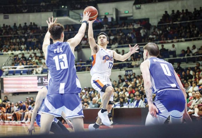 sports_PBA_1_resized Ilonggo Anjo Caram of Meralco Bolts tries to score against the defense of Hong Kong Eastern’s Yuet Yeung Pok. PBA PHOTO