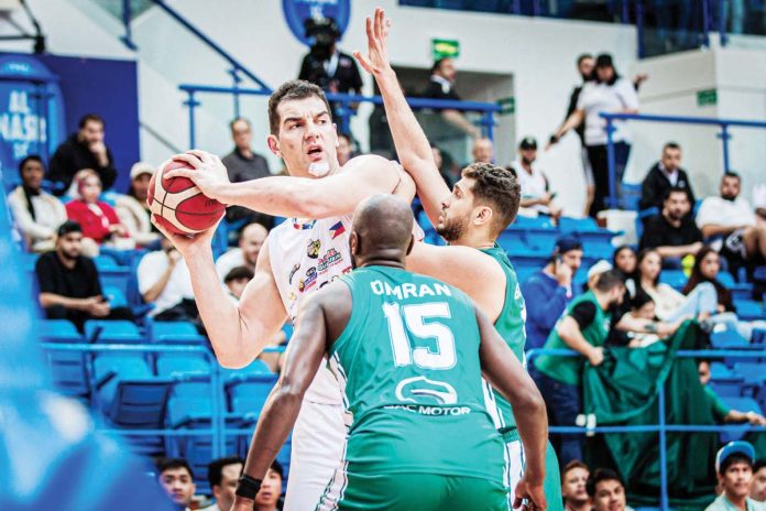sports_Zamboanga_resized Zamboanga Valientes center Sam Deguara is clobbered by double teaming defense from Al Ahly Tripoli. Photo courtesy of Dubai Basketball Championships