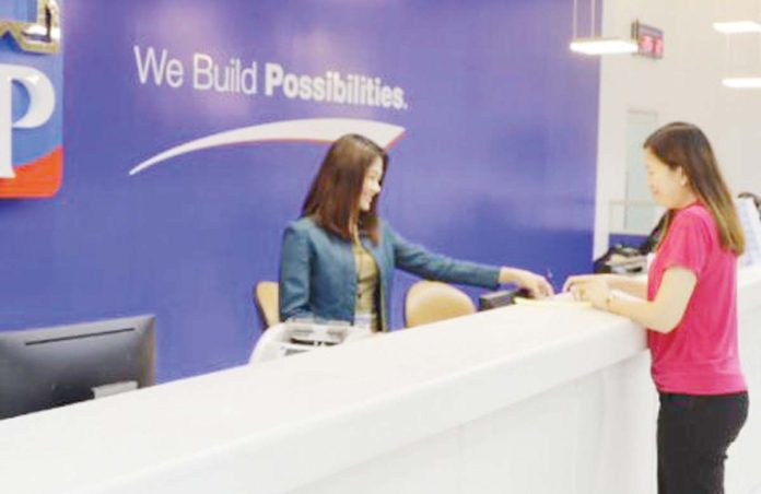 state-banks-1 The Development Bank of the Philippines assured the public that it remains financially strong and more than capable to support President Ferdinand R. Marcos, Jr.’s 10-point economic agenda. Photo shows a DBP teller assisting a customer. DBP PHOTO