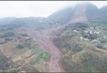One dead, 28 missing after China landslide An aerial shot shows the damage after a landslide in south-western China. A large brown slash of mud and rock cuts through the otherwise green landscape in Jinping village in Sichuan province. XINHUA/AP