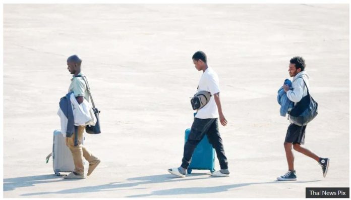 Myanmar_1_resized Three people released from scam centers walk across a tarmac in Mynamar. The scammers look for workers with skills in the languages of those who are targeted for cyber-fraud, usually English and Chinese. THAI NEWS PIX