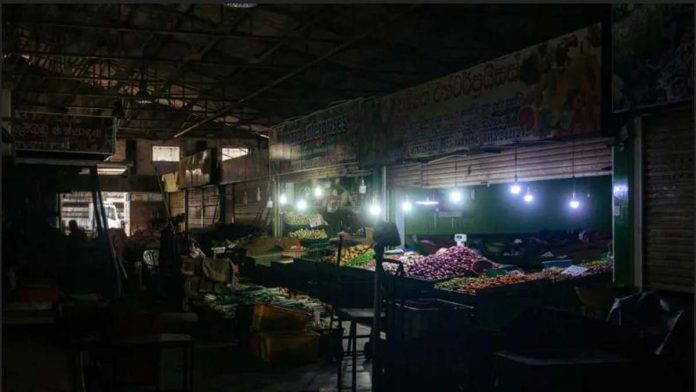 Sri-Lanka Fruit stalls are seen in Kirimandala Market during a power cut in Colombo, Sri Lanka. GETTY IMAGES